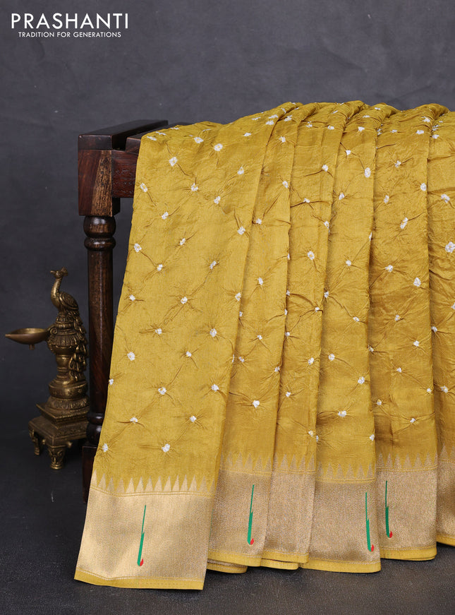 Dola silk saree mustard yellow with allover bandhani prints and muniya butta border