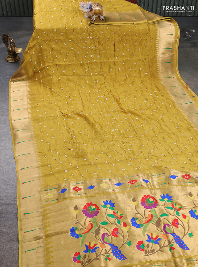 Dola silk saree mustard yellow with allover bandhani prints and muniya butta border