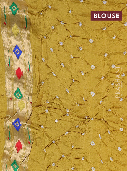 Dola silk saree mustard yellow with allover bandhani prints and muniya butta border