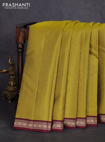 Pure kanchipuram silk saree mehendi green and deep maroon with allover zari small checked pattern and small zari woven korvai border