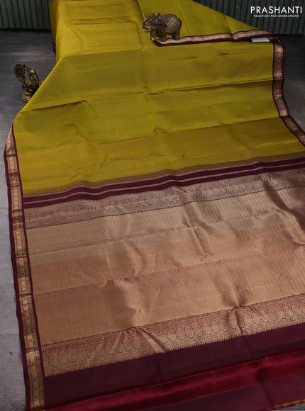 Pure kanchipuram silk saree mehendi green and deep maroon with allover zari small checked pattern and small zari woven korvai border