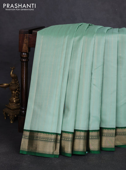 Pure kanchipuram silk saree pastel green and bottle green with allover zari stripe pattern and zari woven korvai border