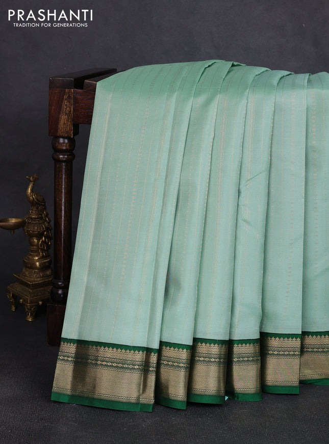Pure kanchipuram silk saree pastel green and bottle green with allover zari stripe pattern and zari woven korvai border