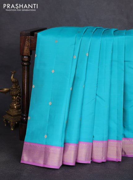 Pure kanchipuram silk saree teal blue and lavender with allover zari woven buttas and zari woven korvai border