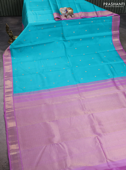 Pure kanchipuram silk saree teal blue and lavender with allover zari woven buttas and zari woven korvai border