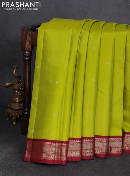 Pure kanchipuram silk saree light green and deep maroon with allover zari woven buttas and zari woven korvai border