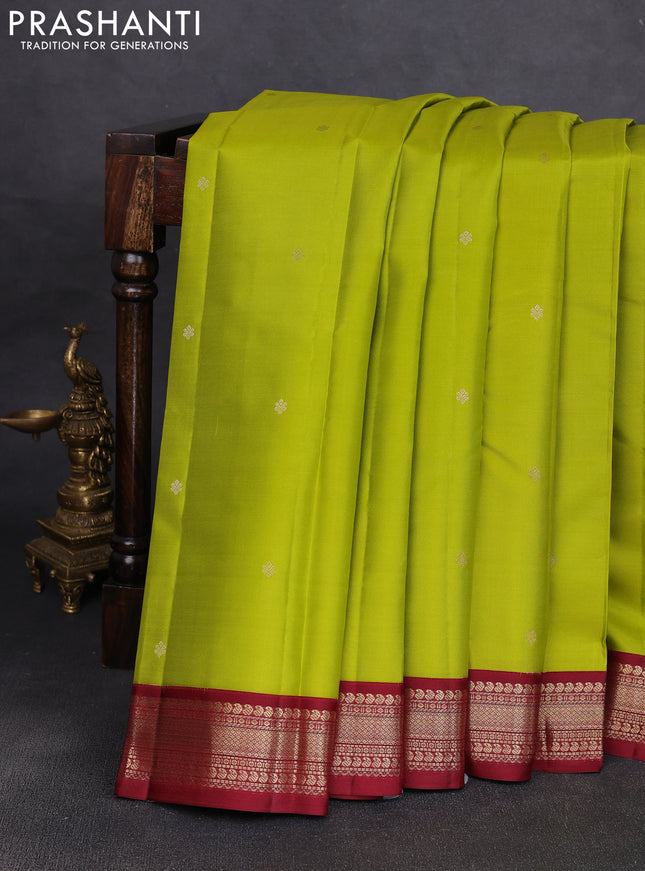 Pure kanchipuram silk saree light green and deep maroon with allover zari woven buttas and zari woven korvai border
