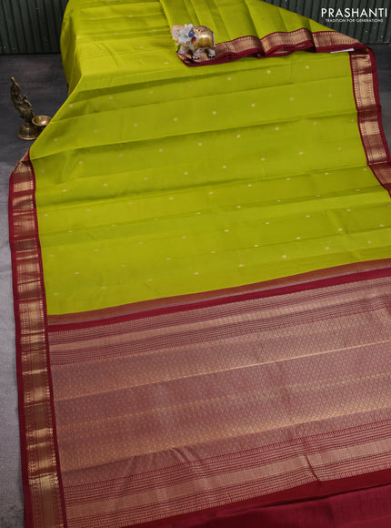 Pure kanchipuram silk saree light green and deep maroon with allover zari woven buttas and zari woven korvai border