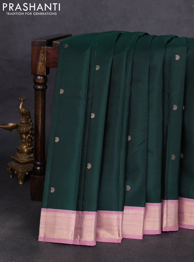 Pure kanchipuram silk saree bottle green and pastel pink with allover paisley zari woven buttas and zari woven korvai border