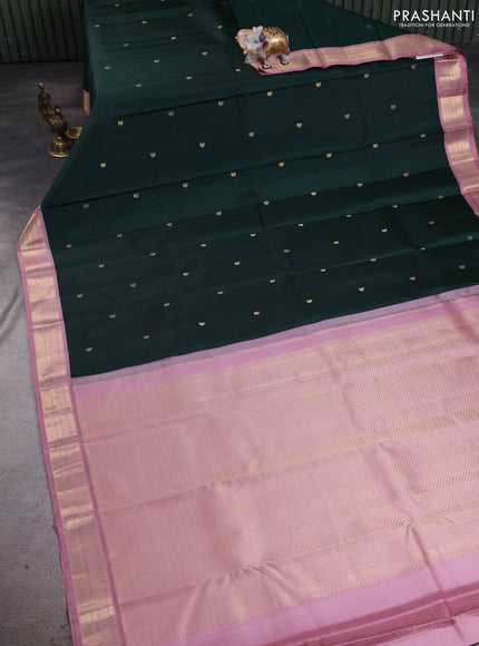 Pure kanchipuram silk saree bottle green and pastel pink with allover paisley zari woven buttas and zari woven korvai border