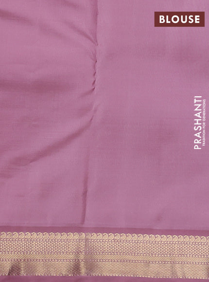 Pure kanchipuram silk saree bottle green and pastel pink with allover paisley zari woven buttas and zari woven korvai border