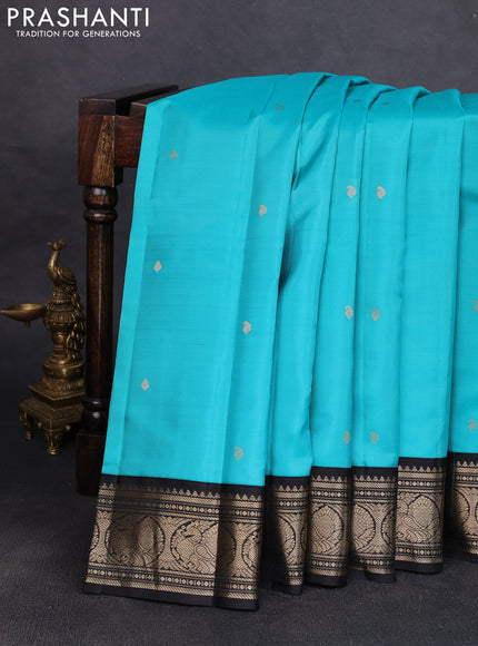 Pure kanchipuram silk saree teal blue and black with allover zari woven buttas and zari woven korvai border