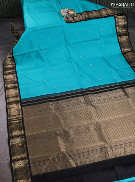 Pure kanchipuram silk saree teal blue and black with allover zari woven buttas and zari woven korvai border