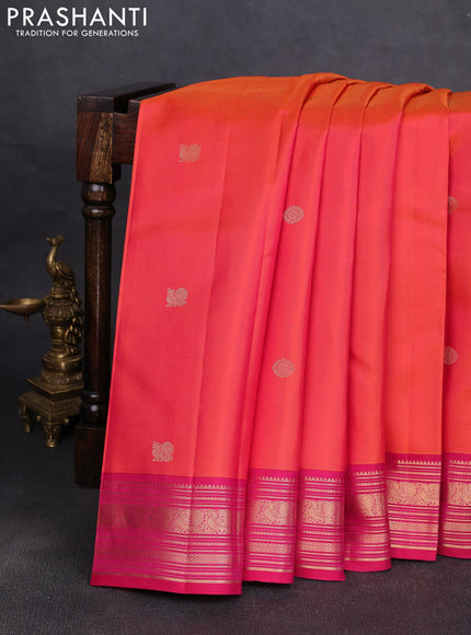 Pure kanchipuram silk saree dual shade of pinkish orange and dark pink with allover vairaosi pattern & zari buttas and zari woven korvai border