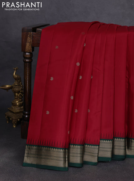 Pure kanchipuram silk saree red and bottle green with allover zari woven buttas and temple design zari woven korvai border