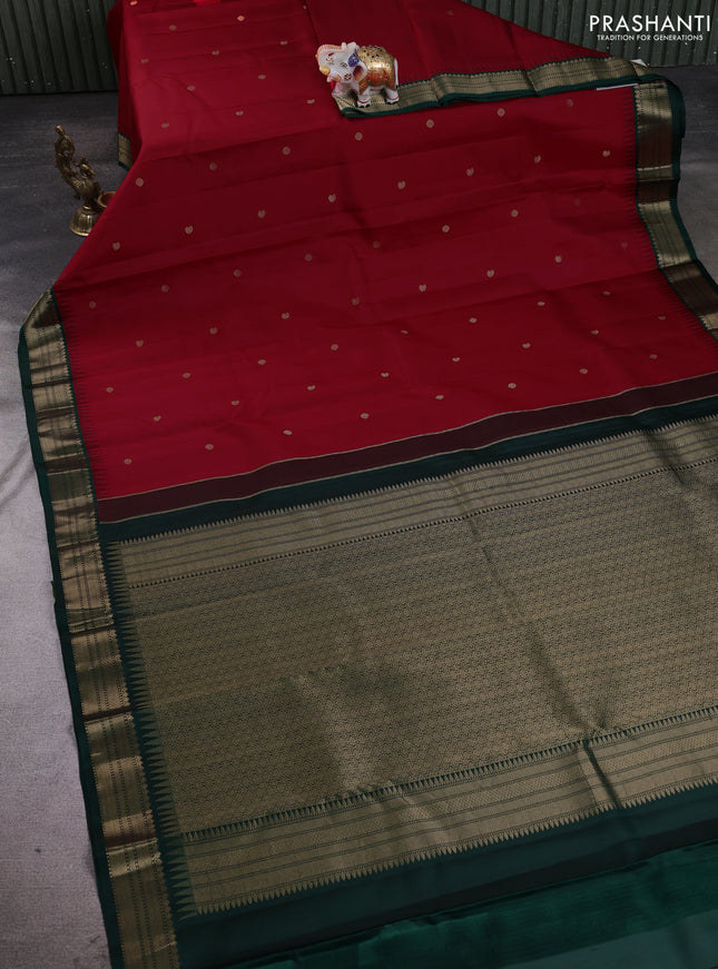 Pure kanchipuram silk saree red and bottle green with allover zari woven buttas and temple design zari woven korvai border