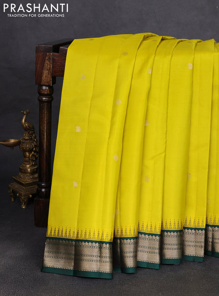 Pure kanchipuram silk saree lime yellow and bottle green with allover zari woven buttas and temple design zari woven korvai border