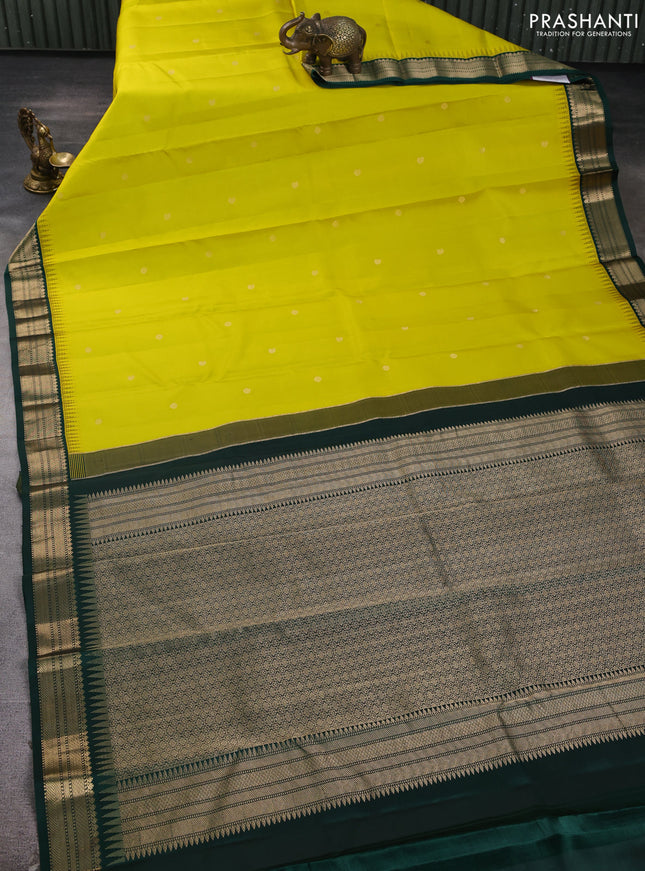 Pure kanchipuram silk saree lime yellow and bottle green with allover zari woven buttas and temple design zari woven korvai border