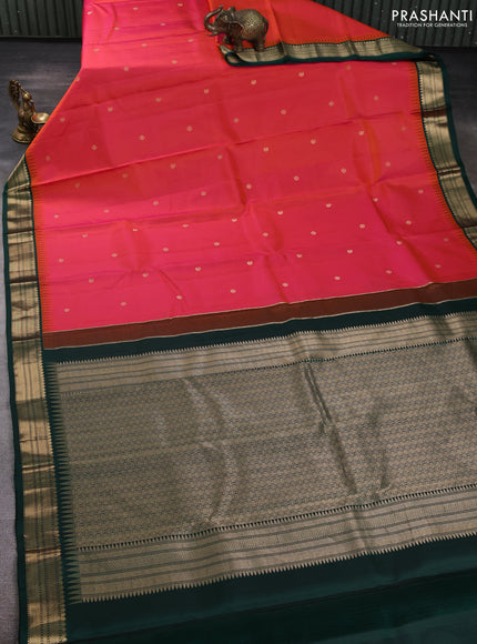 Pure kanchipuram silk saree dual shade of pinkish orange and bottle green with allover zari woven buttas and temple design zari woven korvai border