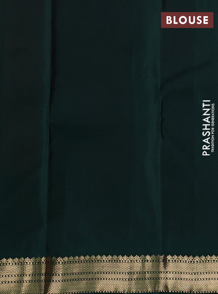 Pure kanchipuram silk saree dual shade of pinkish orange and bottle green with allover zari woven buttas and temple design zari woven korvai border