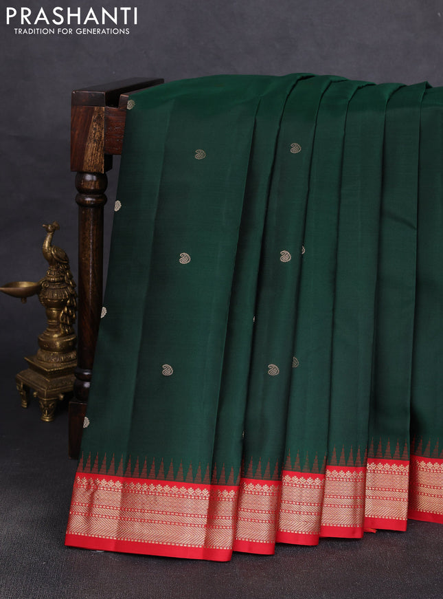 Pure kanchipuram silk saree bottle green and red with allover zari woven buttas and temple design zari woven korvai border