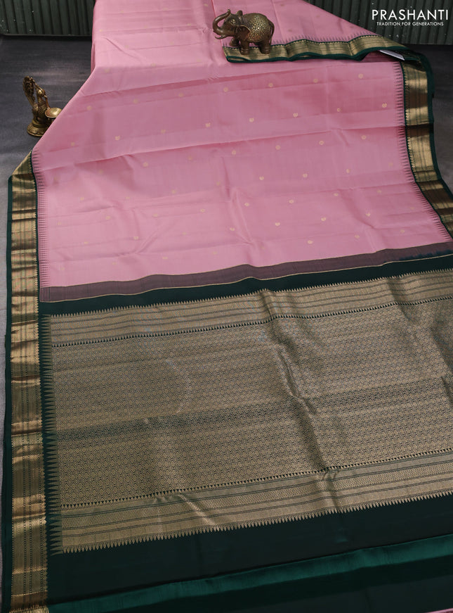 Pure kanchipuram silk saree pastel pink and bottle green with allover zari woven buttas and temple design zari woven korvai border