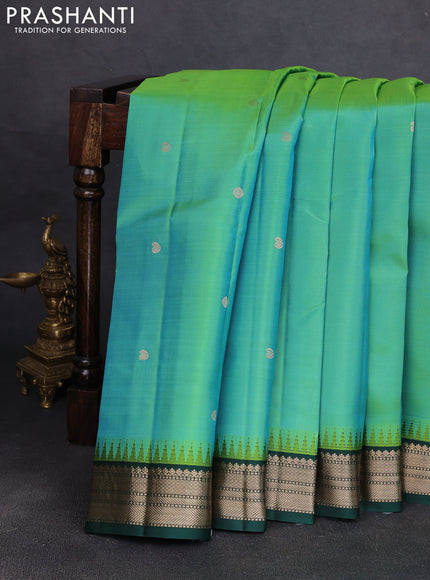 Pure kanchipuram silk saree teal bluish green and bottle green with allover zari woven buttas and temple design zari woven korvai border