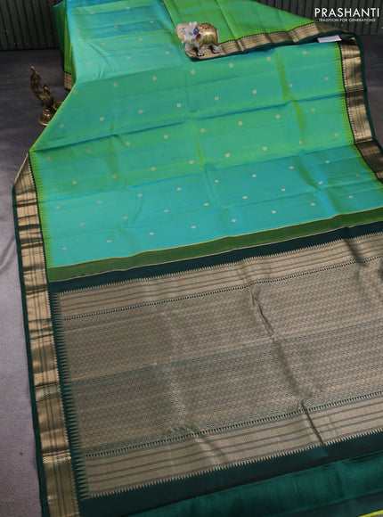 Pure kanchipuram silk saree teal bluish green and bottle green with allover zari woven buttas and temple design zari woven korvai border