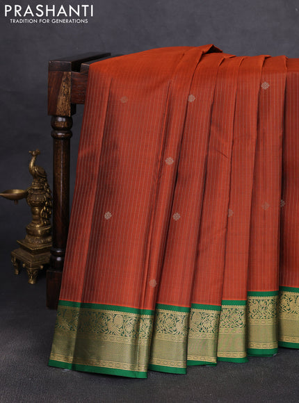Pure kanchipuram silk saree rustic orange and green with allover zari stripe pattern & buttas and zari woven korvai border