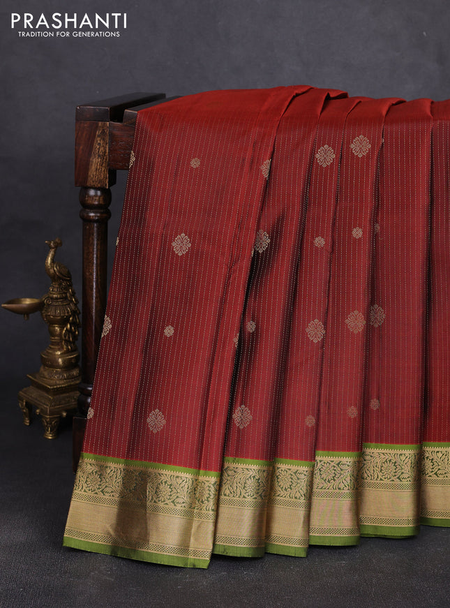 Pure kanchipuram silk saree rust shade and light green with allover zari stripe pattern & buttas and zari woven korvai border