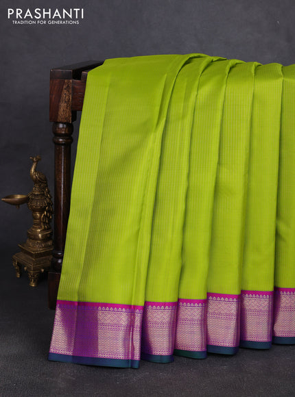 Pure kanchipuram silk saree light green and dark pink with allover zari stripe pattern and zari woven korvai border