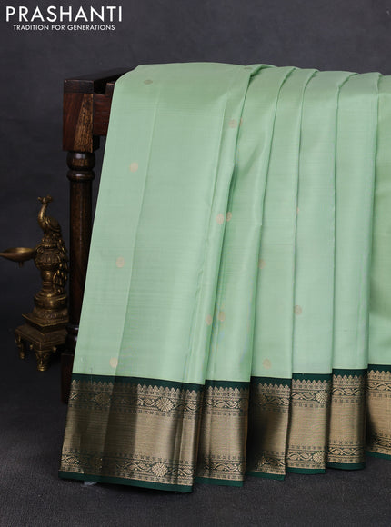 Pure kanchipuram silk saree pista green and bottle green with zari woven buttas and temple design zari woven korvai border