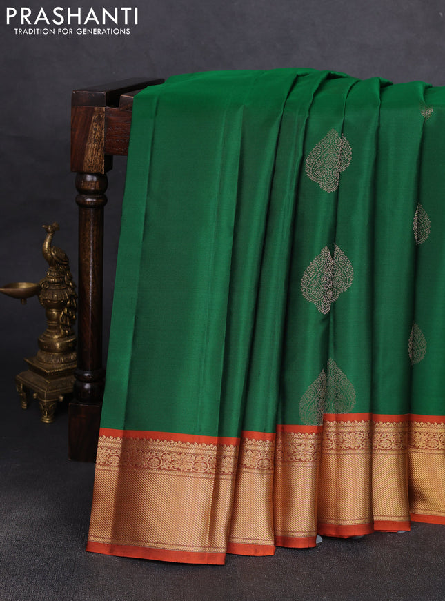 Pure kanchipuram silk saree green and orange with allover zari woven buttas and rich zari woven korvai border