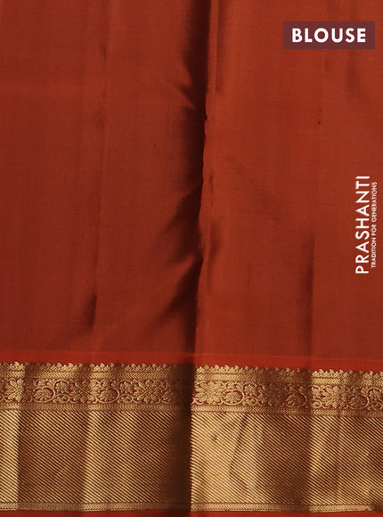 Pure kanchipuram silk saree green and orange with allover zari woven buttas and rich zari woven korvai border