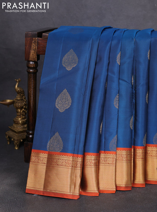 Pure kanchipuram silk saree peacock blue and orange with allover zari woven buttas and rich zari woven korvai border