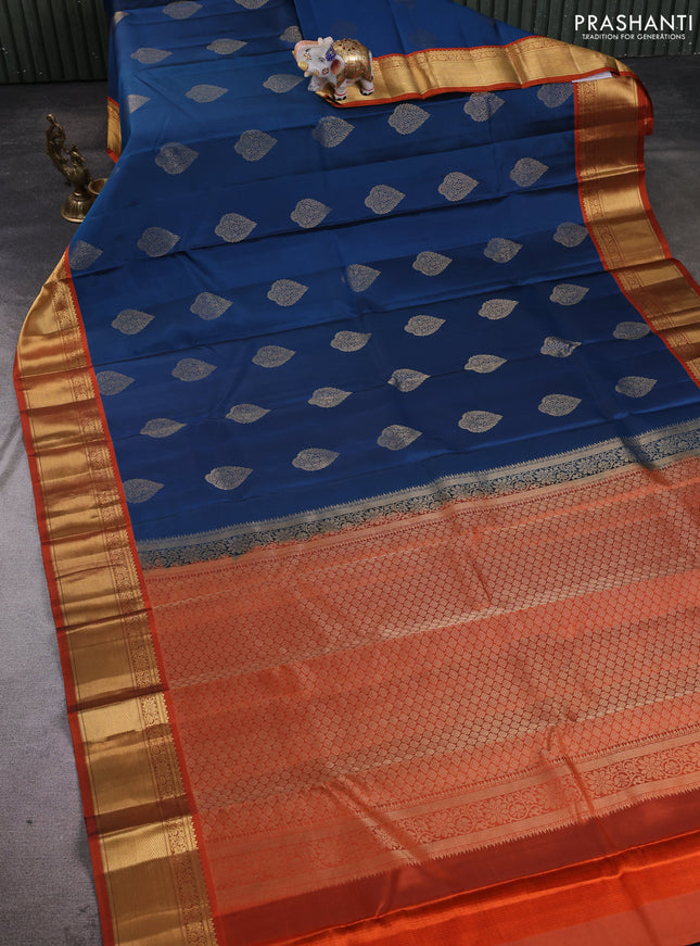 Pure kanchipuram silk saree peacock blue and orange with allover zari woven buttas and rich zari woven korvai border