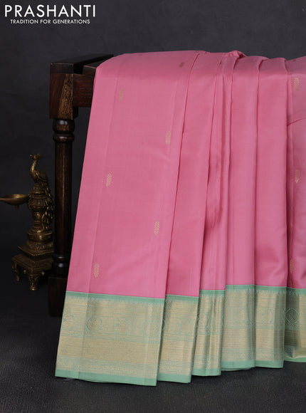 Pure kanchipuram silk saree pastel pink and pastel green with zari woven buttas and temple design zari woven korvai border