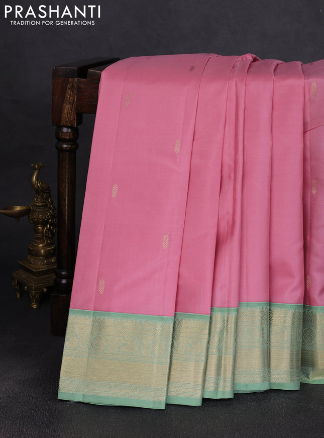 Pure kanchipuram silk saree pastel pink and pastel green with zari woven buttas and temple design zari woven korvai border
