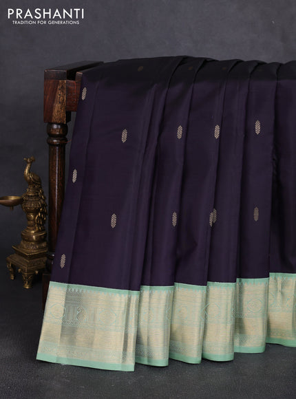 Pure kanchipuram silk saree jamun shade and pastel green with zari woven buttas and temple design zari woven korvai border
