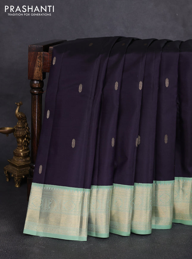 Pure kanchipuram silk saree jamun shade and pastel green with zari woven buttas and temple design zari woven korvai border
