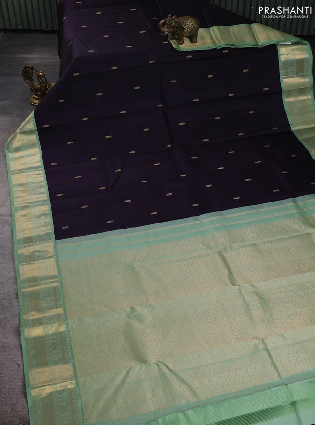 Pure kanchipuram silk saree jamun shade and pastel green with zari woven buttas and temple design zari woven korvai border
