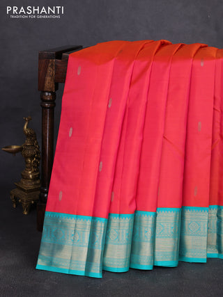 Pure kanchipuram silk saree dual shade of pinkish orange and teal green with zari woven buttas and temple design zari woven korvai border