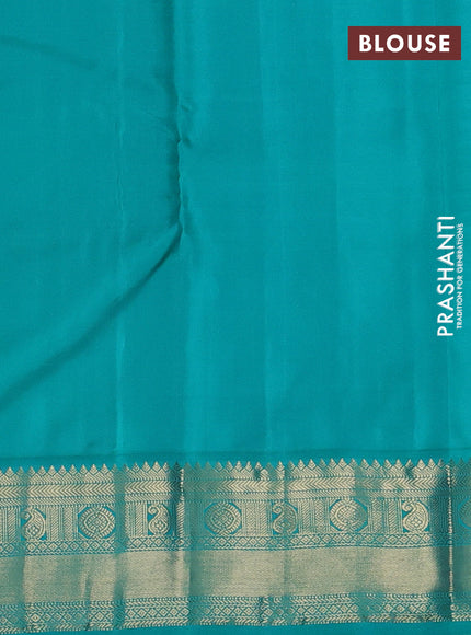 Pure kanchipuram silk saree dual shade of pinkish orange and teal green with zari woven buttas and temple design zari woven korvai border