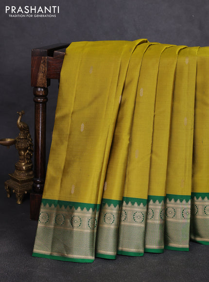 Pure kanchipuram silk saree mustard green and green with zari woven buttas and temple design zari woven korvai border