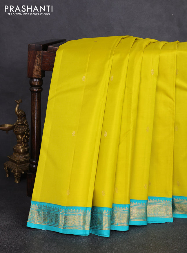 Pure kanchipuram silk saree lime yellow and teal blue with allover zari woven buttas and zari woven korvai border