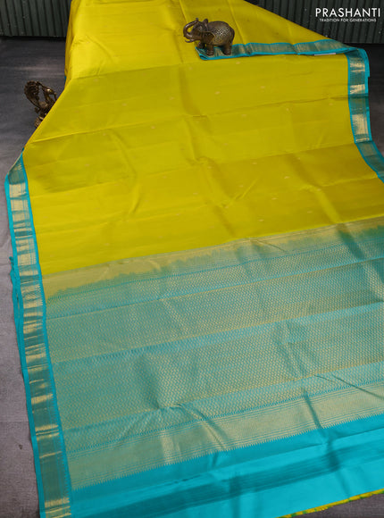Pure kanchipuram silk saree lime yellow and teal blue with allover zari woven buttas and zari woven korvai border