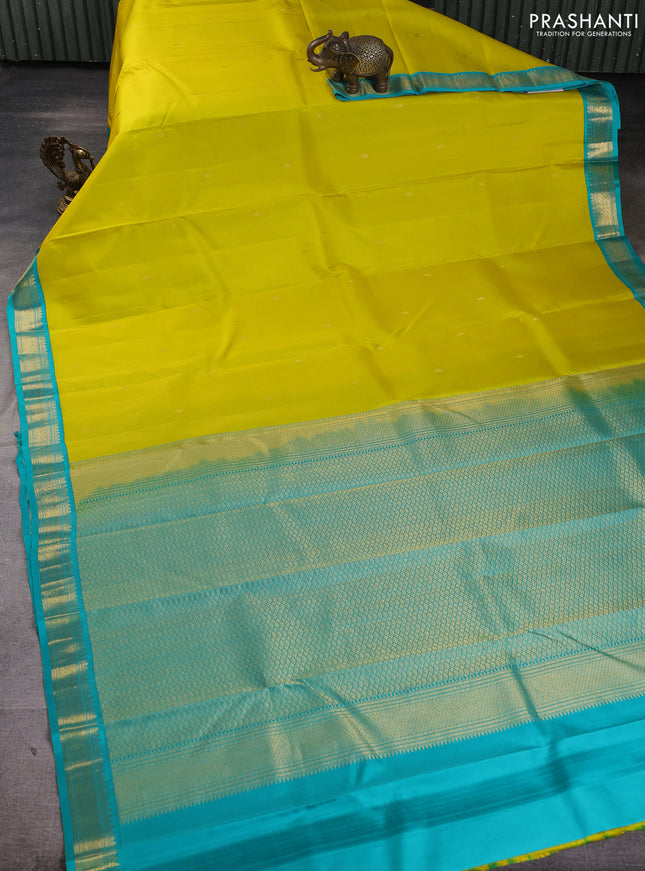 Pure kanchipuram silk saree lime yellow and teal blue with allover zari woven buttas and zari woven korvai border
