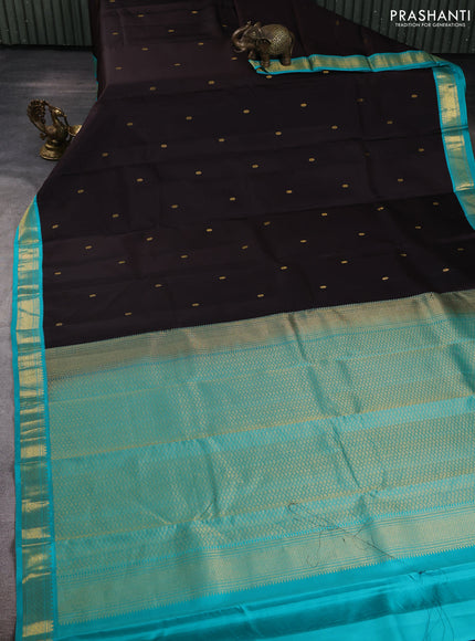Pure kanchipuram silk saree coffee brown and teal blue with allover zari woven butttas and zari woven korvai border