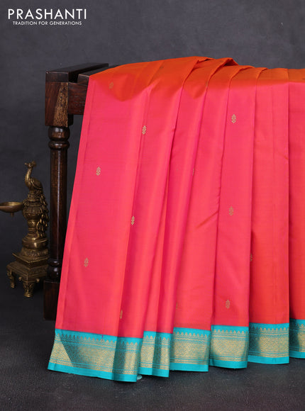 Pure kanchipuram silk saree dual shade of pinkish orange and teal blue with zari woven buttas and zari woven korvai border