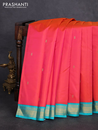 Pure kanchipuram silk saree dual shade of pinkish orange and teal blue with zari woven buttas and zari woven korvai border